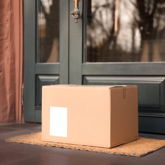 Box delivered in front of a door