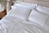 Embroidered Sateen Sheet Set lifestyle close up