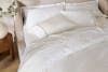 Embroidered Sateen Pillowcase Pair lifestyle angle